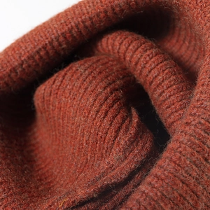 Rust red rib-knit winter beanie hat for men and women featuring warm textured wool yarn