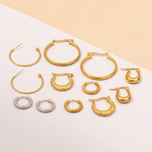 Detail view of 18K gold and silver plated hoop earrings with various textures and sizes