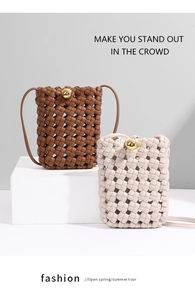 Detailed view of woven leather mini crossbody bags in brown and beige with gold spherical buckles