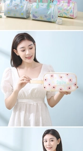 Detailed view of portable floral PVC makeup bags with handles in various colors
