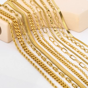 Detailed close-up showing various golden stainless steel chain textures and styles