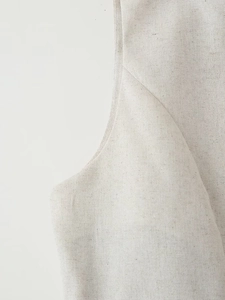 Detailed close-up showing the linen blend fabric texture and stitching of the beige set