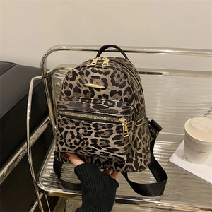 Mini leopard print backpack made of oxford fabric with gold zippers for trendy travel