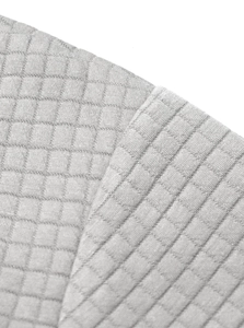 Macro shot of grey checkered quilted fabric texture on business casual sweatshirt