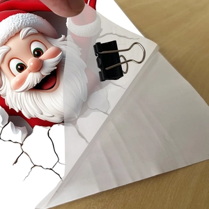 Close-up of 3D Santa Claus wall sticker being peeled, showing high-quality PVC material