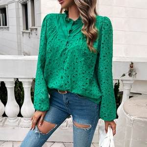 Green lace long sleeve shirt with V-neck and puff sleeves paired with denim jeans