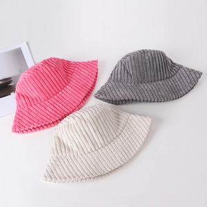 Women's corduroy bucket hats in pink, grey, and cream colors on white background