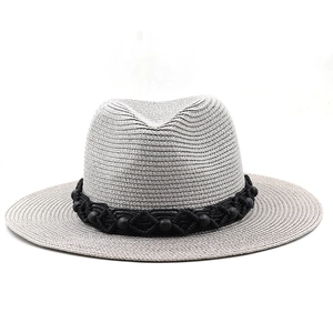 Off-white straw fedora hat with black beaded band in a bohemian panama style for sun protection