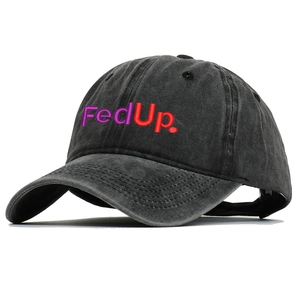Macro shot of purple and red FedUp embroidery on a washed black denim baseball cap
