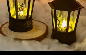 Detail of Halloween LED lantern with wizard and pumpkin motifs on a rustic background