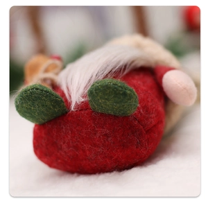 Close-up of a Nordic Christmas gnome with red felt hat and long white plush beard detail