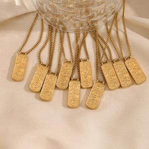 18K gold plated stainless steel tarot number pendant necklaces on beige silk background