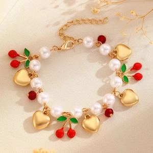 Sweet strawberry and heart charm bracelet with faux pearls and golden chain