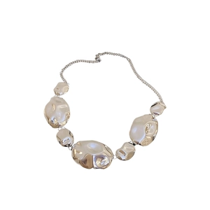Exaggerated silver crinkle necklace set with irregular textured metallic pendants