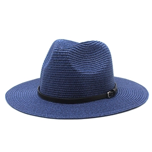 Detail of dark blue straw fedora hat featuring a black leather band and silver metal buckle