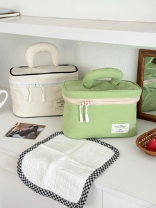 Detail view of large nylon makeup bags with soft handles and dual zipper closure