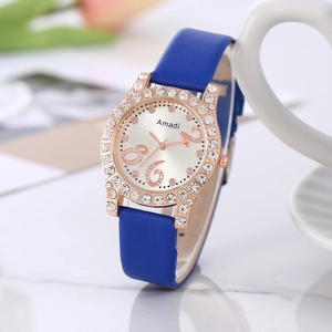 Montre à quartz élégante pour femme avec strass brillants et bracelet en cuir bleu