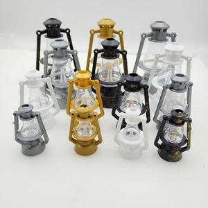 Mini plastic vintage lantern ornaments in gold, silver, black, white, and bronze colors