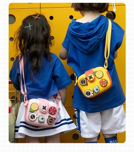 Rear view of children wearing mini silicone crossbody bags with adjustable straps