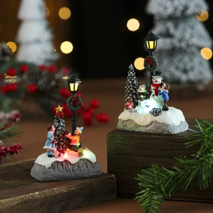 Light-up Christmas resin village figurines with snowman and tree on rustic wood base
