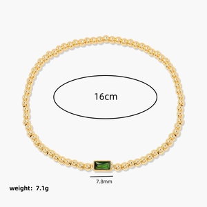 Minimalist gold beaded bracelet with emerald-cut green gemstone and 16cm circumference