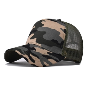 Macro detail of jungle camouflage cotton mesh trucker hat with breathable curved brim