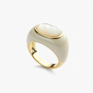 Detail of 18k gold plated ring with cream enamel and white mother of pearl inlay