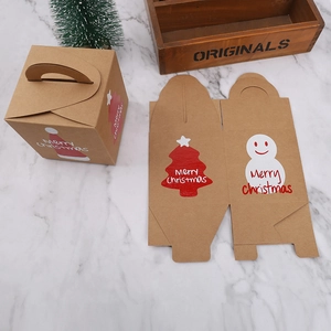 Detail of kraft paper Christmas gift boxes with tree and snowman prints in a cozy setup