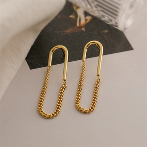 18K gold plated U-shaped chain drop earrings on minimalist beige background