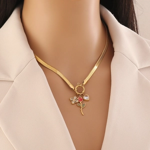 Golden snake chain necklace with rose, diamond butterfly and heart pendants on model