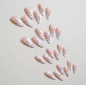 24pcs almond press-on nails with white French V-tips and floral line art on nude base