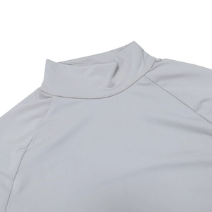 Close-up of light grey high-neck athletic dress showing raglan sleeves and fine stitching