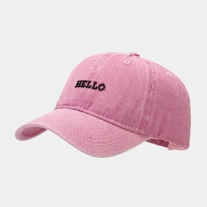 Detail of vintage washed pink baseball cap with HELLO black embroidery and reinforced stitching