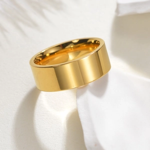 Minimalist wide golden stainless steel ring with a high-polished smooth surface