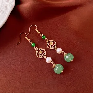 New Chinese style flower pearl tassel earrings with green stone on brown silk fabric