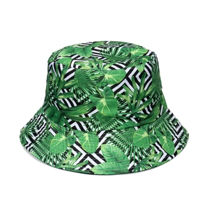 Close-up of tropical palm leaf print and geometric zigzag pattern on a bucket hat