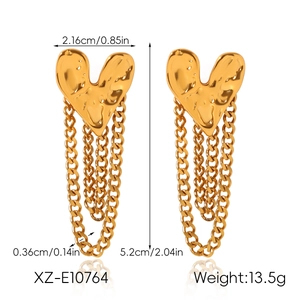 Detail view of gold heart chain earrings with size measurements 5.2cm by 2.16cm