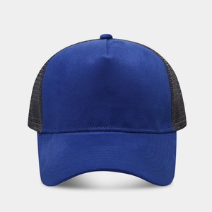 Detail of royal blue faux suede front and black mesh breathable panels on trucker hat