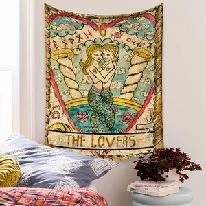 Detailed macro view of bohemian tarot tapestry featuring the lovers mermaid design