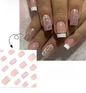 Detail of square nails with white French tips, pink glitter, and butterfly patterns