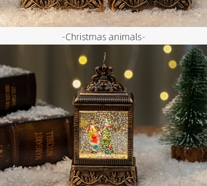 Detail of vintage Christmas lantern with snow scene and bronze floral embossed frame