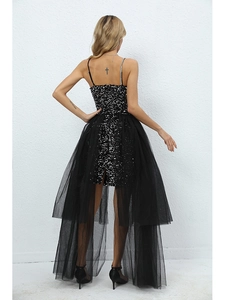 Detail of elegant black sequin dress featuring detachable layered mesh tulle skirt