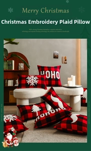 Detail of Christmas buffalo plaid pillow covers with white snowflake and tree embroidery