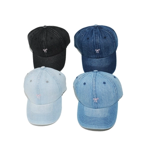 Denim baseball caps with pink bow embroidery in black and blue washes for women
