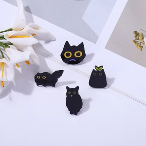 Set of 4 cute black cat enamel pins in various poses for backpack and clothing decor