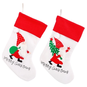 Christmas gnome stockings with red and white fabric and merry Christmas embroidery