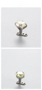 Macro shot of 6mm zircon dermal anchor with titanium base in clear and yellow stones