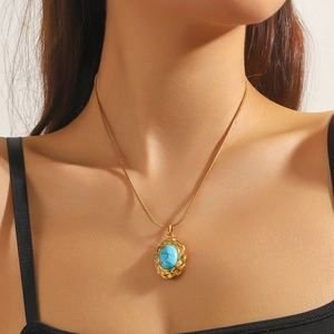 Vintage stainless steel necklace with oval turquoise pendant and gold braided texture