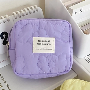 Purple quilted floral cosmetic pouch with soft padded fabric and zipper for travel