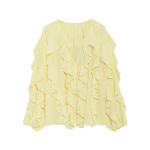 Detail of light yellow V-neck shirt with layered ruffles and brand size S label on neck
